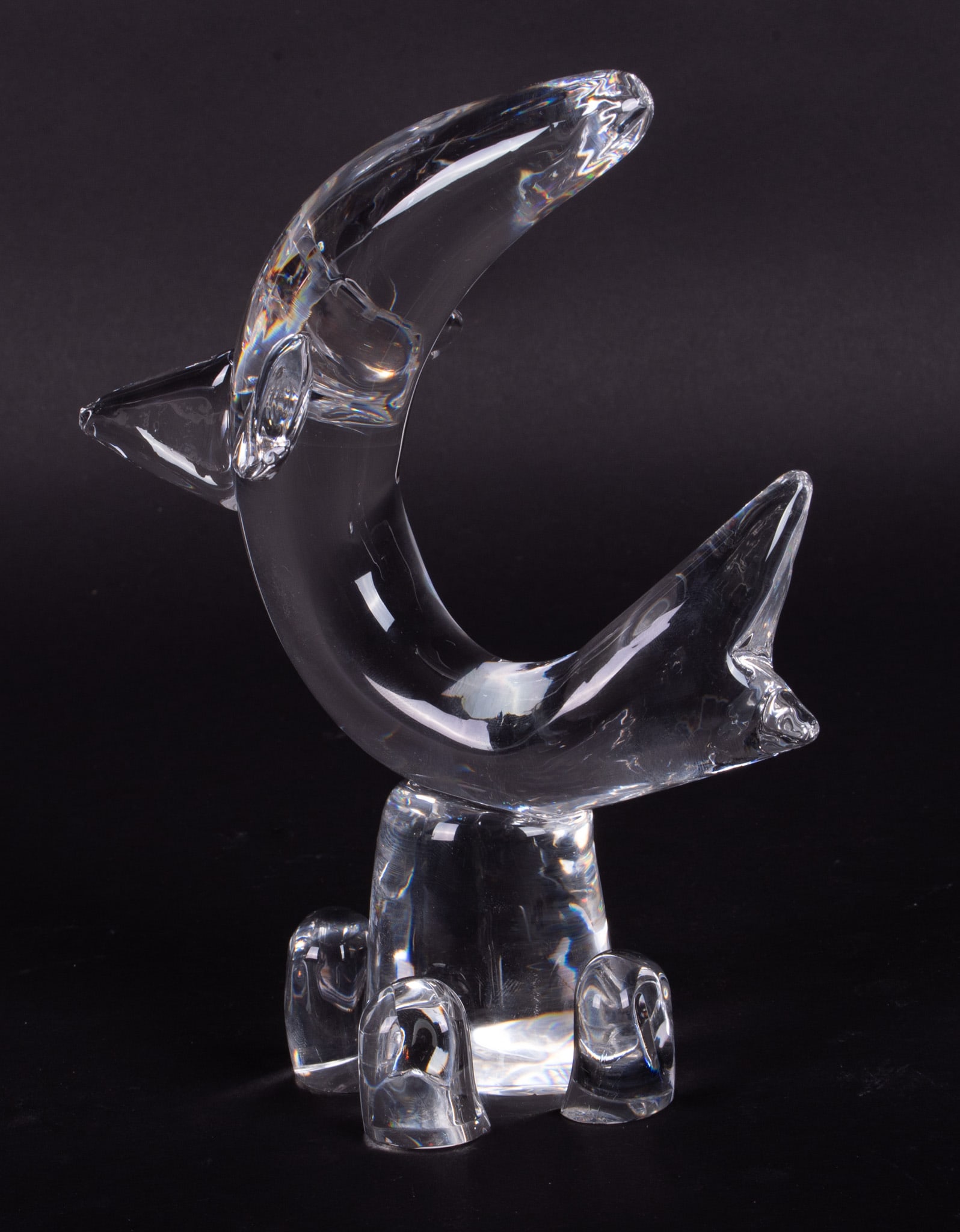 A Steuben Crystal Sculpture of a Leaping Dolphin: A Steuben Crystal Sculpture of a Leaping Dolphin Corning NY, late 20th century, a contemporary desk weight of a dolphin jumping. Script Steuben signature to base. 6 1/2 x 8 5/8 inches
