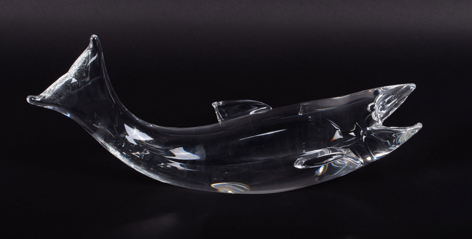 A Large Crystal Sculpture of a Salmon, James Houston for Steuben: A Large Crystal Sculpture of a Salmon, James Houston for SteubenCorning NY, from a 1975 design and part of the Steuben Heritage Series, the fish modeled in a naturalistic curved pose. Signed in script