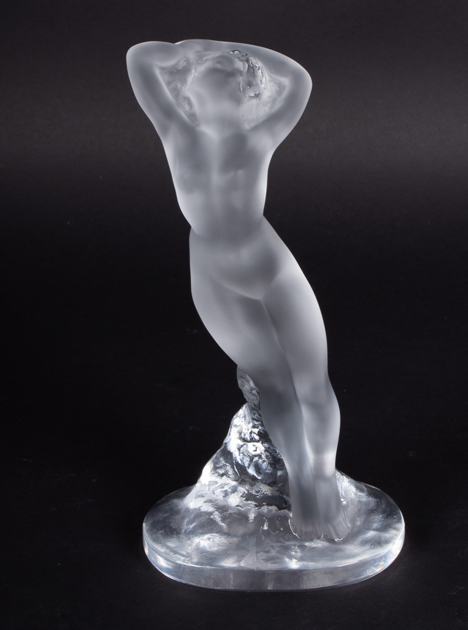 A Lalique Crystal Nude Sculpture, Danseuse Bras Baisse: A Lalique Crystal Nude Sculpture, Danseuse Bras BaisseFrance, late 20th century, a crystal figure of a nude female dancer, signed Lalique France to base.4 1/2 x 9 1/2 inches