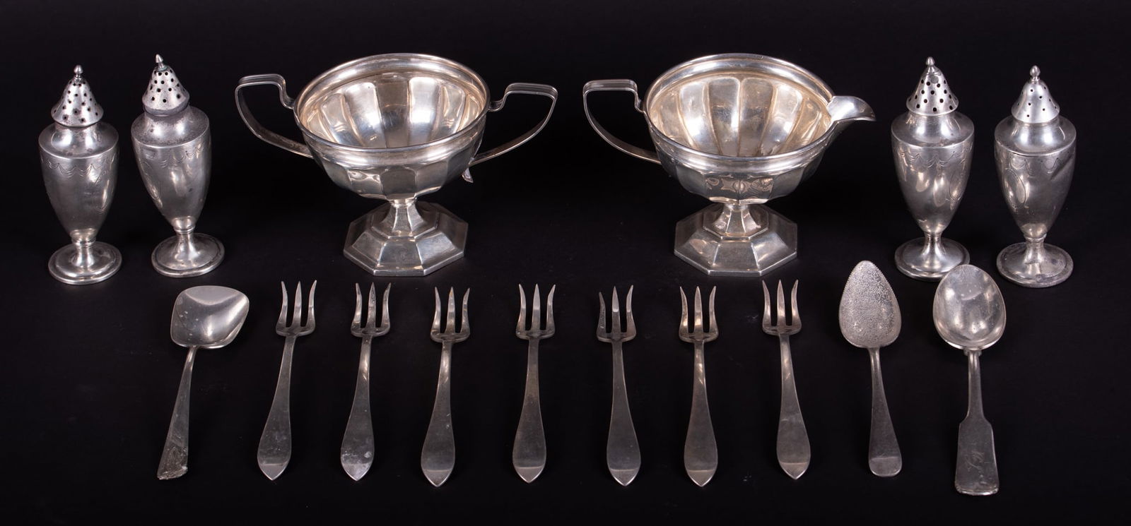 Collection of Sterling Dining Articles along with Two Silverplate Spoons: Collection of Sterling Dining Articles along with Two Silverplate Spoons Sterling creamer and sugar from Webster. Four Sterling salt and pepper shakers marked B S/C. Seven (7) cocktail forks from