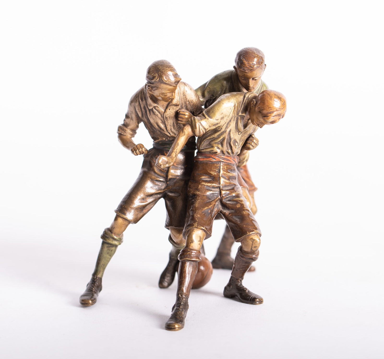 A Rare Cold Painted Bronze of Men Playing Football (Soccer), by Franz Bergman: A Rare Cold Painted Bronze of Men Playing Football (Soccer), by Franz Bergman Austria, Franz Bergman(n) 1861-1936, a very finely detailed bronze sculpture of 3 men playing football (soccer). The