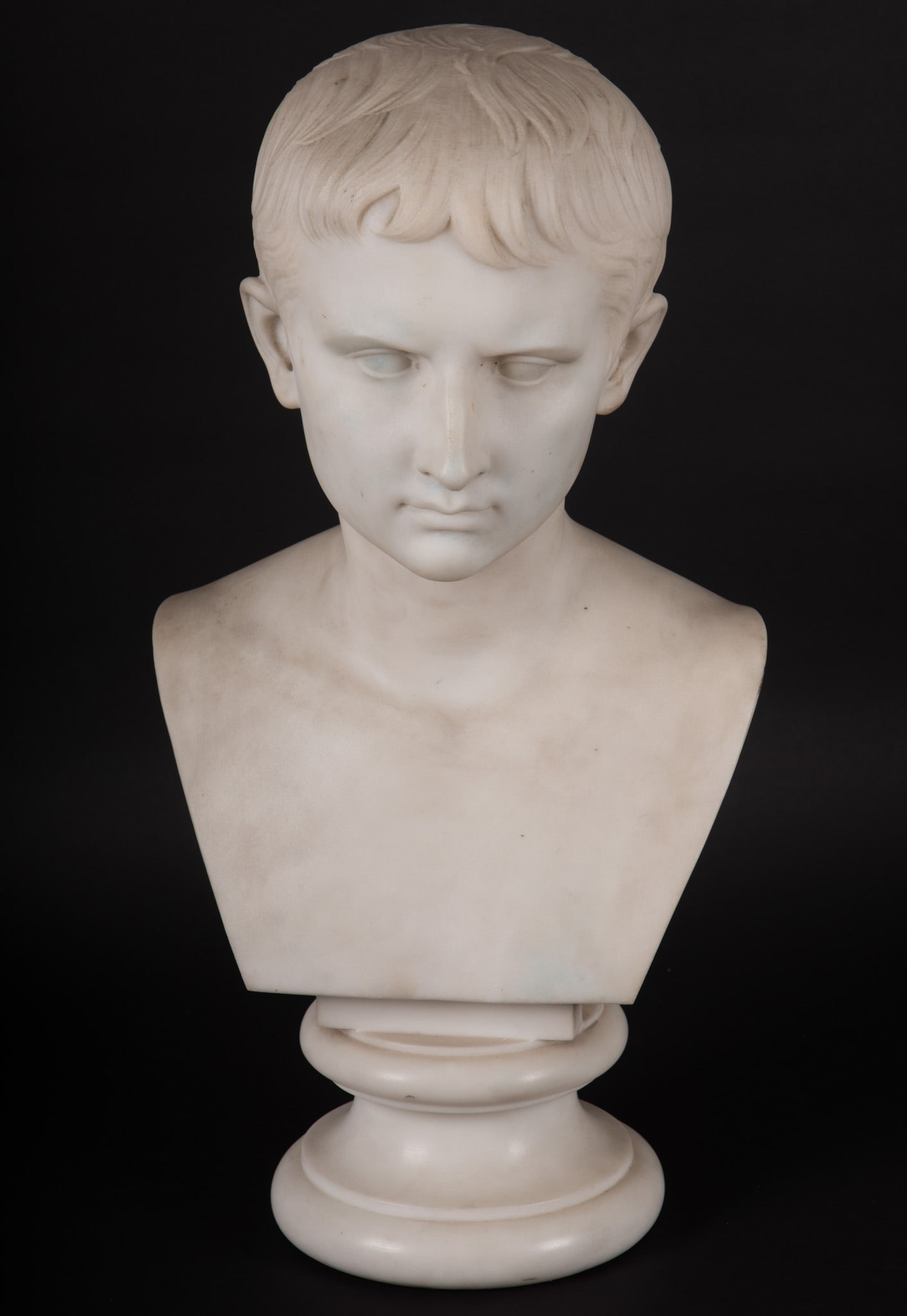 A Large Grand Tour Marble Bust of the Young Octavian: A Large Grand Tour Marble Bust of the Young Octavian Italian, 19th century, After the original in the Vatican Museum, a finely sculpted bust depicting Octavian, later Augustus Caesar. The 22 inch