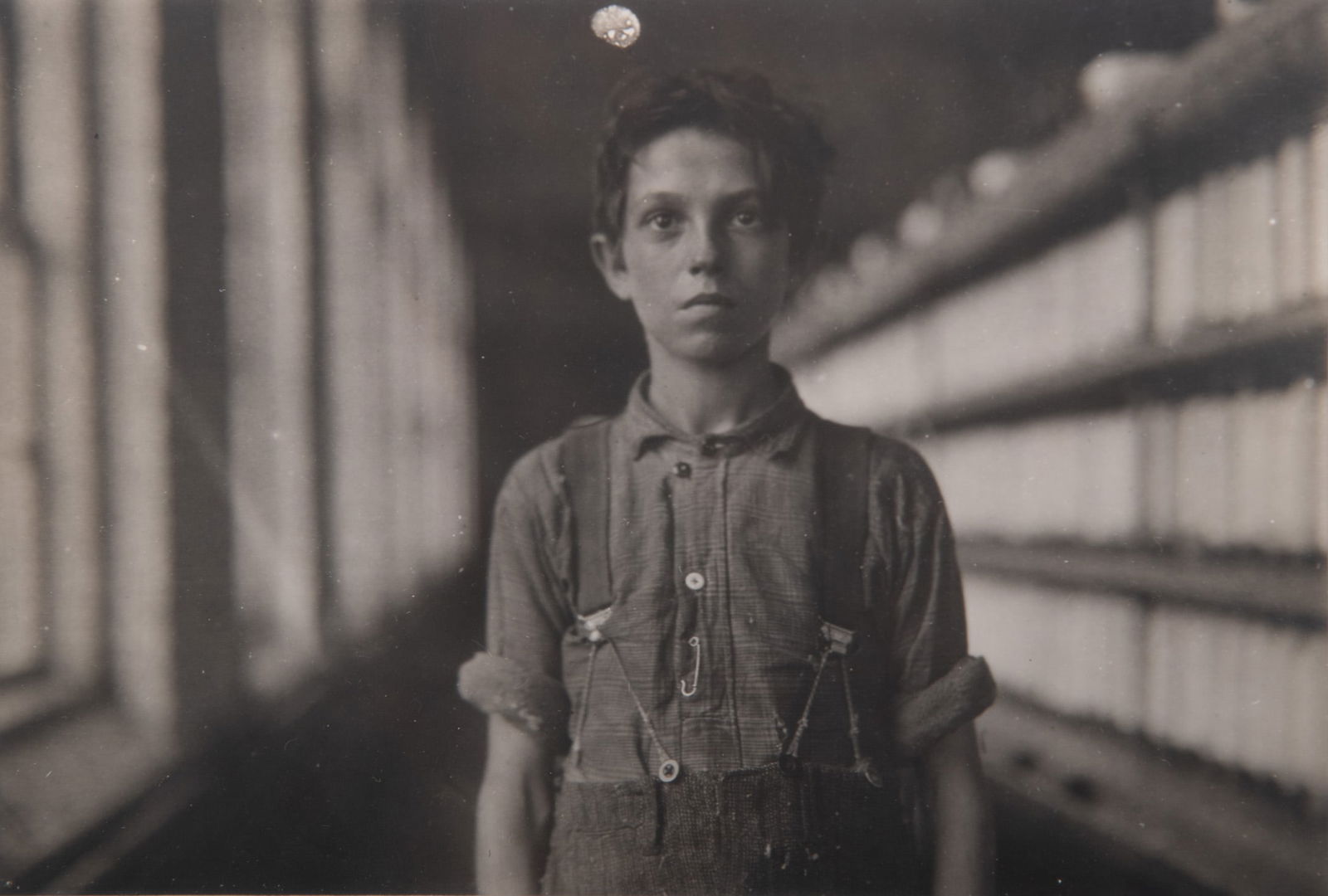 Lewis W Hine, American (1874-1940), Jo Bodeon, a 'Back-Roper' in Mule Room, 1909, gelatin silver: Lewis W HineAmerican, (1874-1940)Jo Bodeon, a 'Back-Roper' in Mule Room, 1909gelatin silver printframed.4 1/2 x 6 1/2 inches (visible); 10 1/4 x 12 inches (overall with frame)