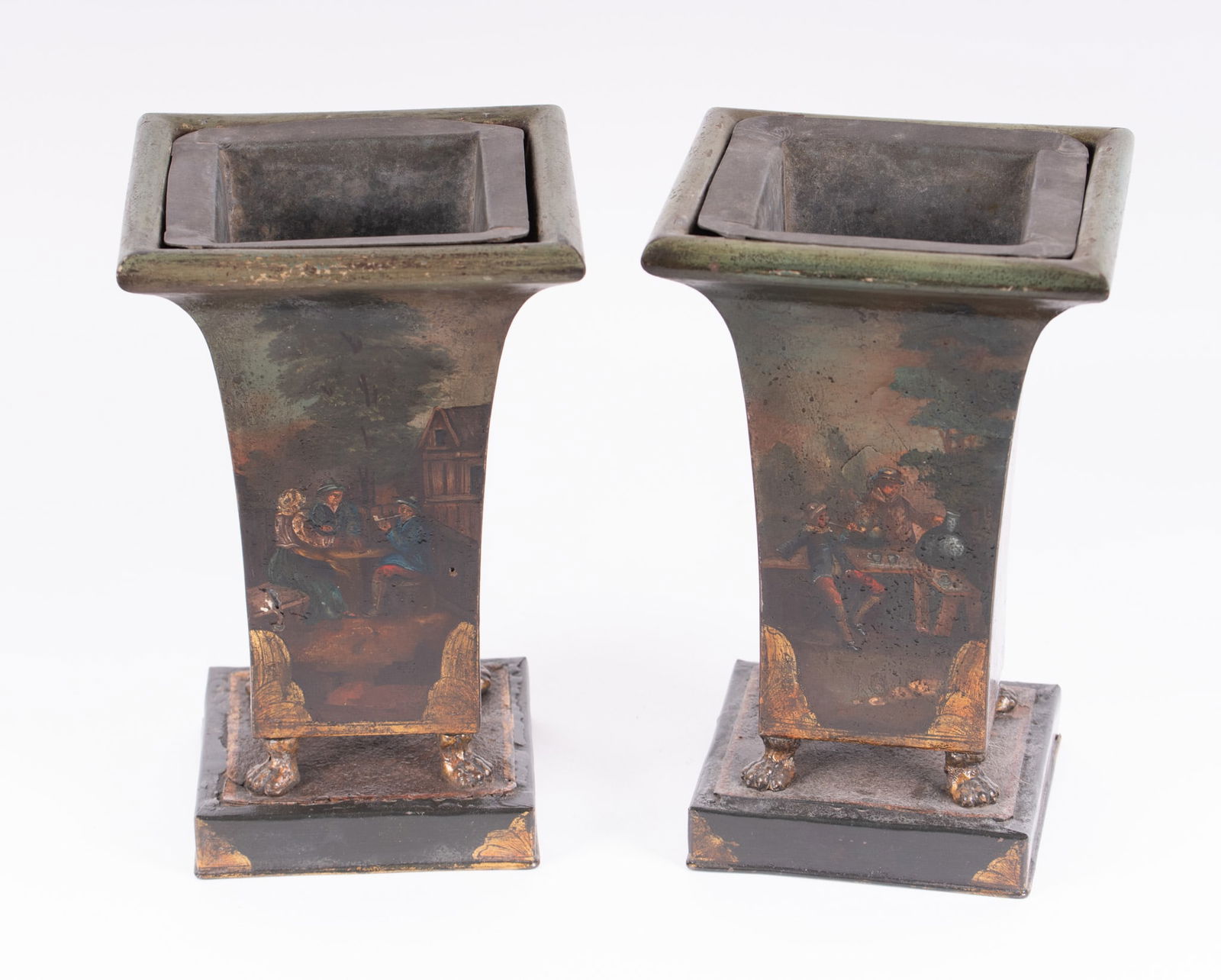 A Pair of Antique French Neo-Classical Painted Tole Mantel Urns: A Pair of Antique French Neo-Classical Painted Tole Mantel UrnsFrance, early 19th century, each panel on the metal lined vases depicting a different scene with figures and horses within farm town and