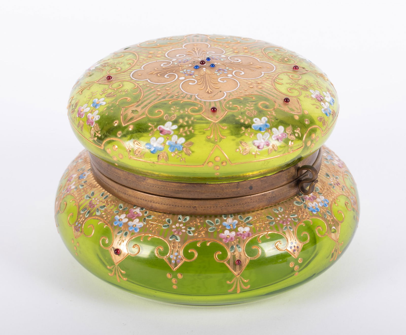 A Large Moser Style Enameled and Jeweled Dresser Box, 19th Century: A Large Moser Style Enameled and Jeweled Dresser Box, 19th Century Bohemia, 19th century, a hinged-lidded green glass dresser or powder box, the exterior enameled with flowers amidst gilt highlights,