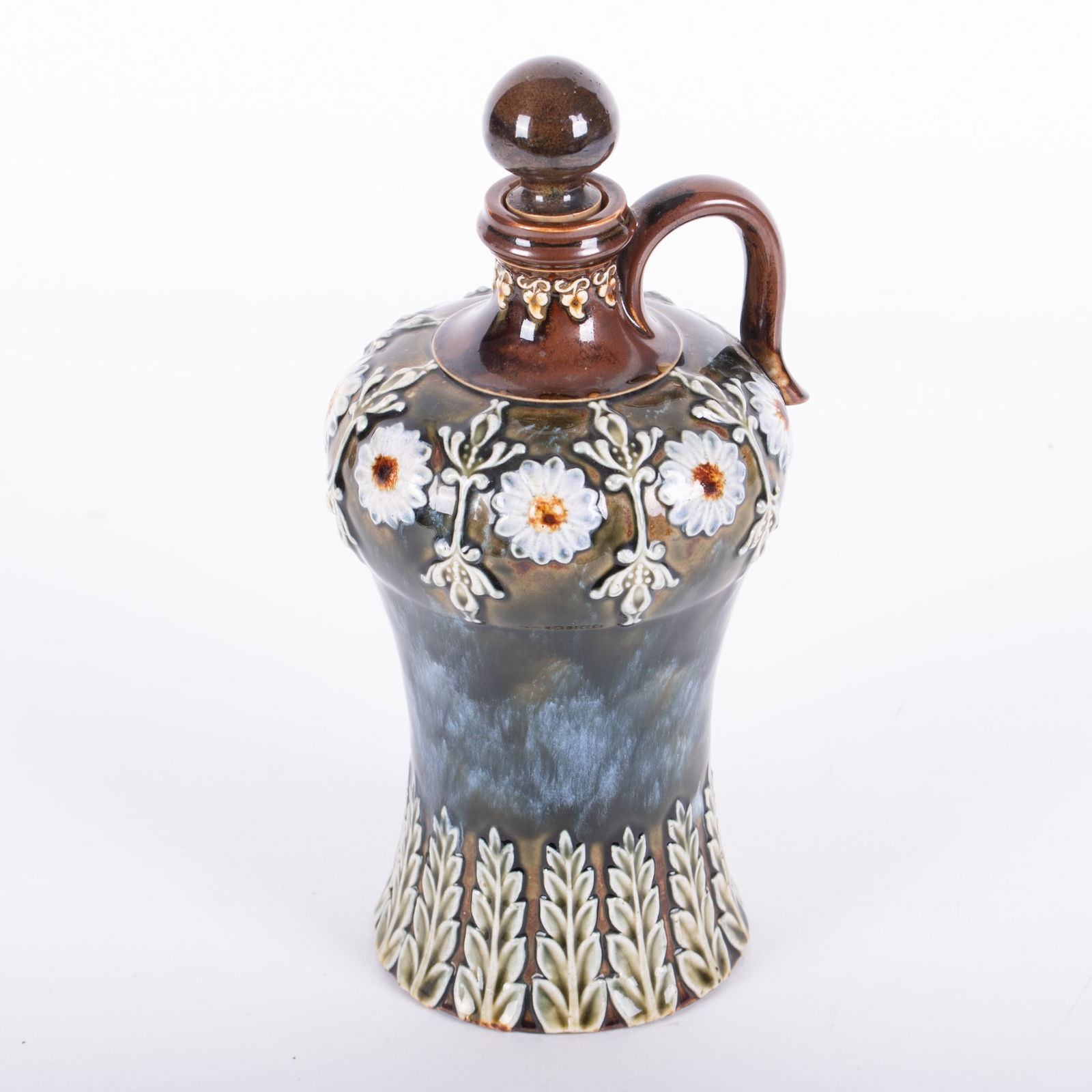 Doulton Lambeth Vase: Doulton Lambeth Vase brown glazed vase with stopper and floral design. marked on base 9 1/2 inches