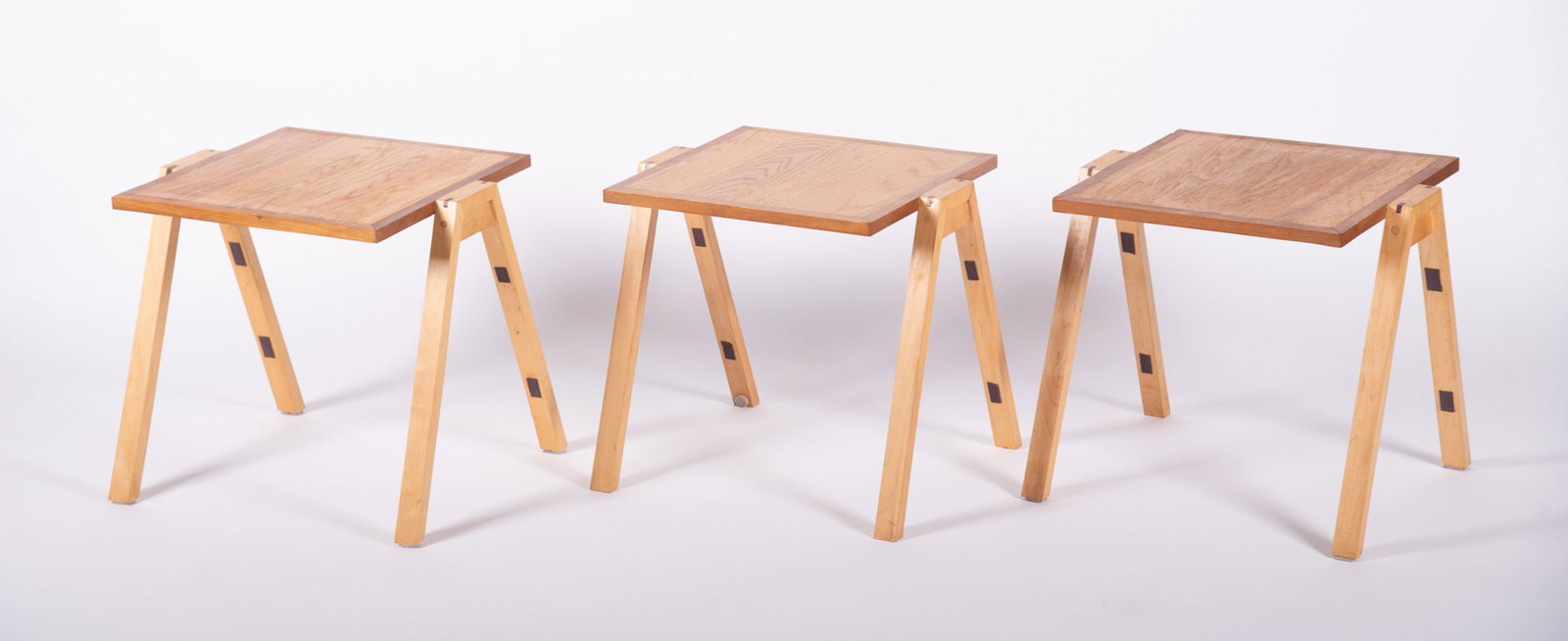 A Set of Three Blonde Wood Stackable Tables: A Set of Three Blonde Wood Stackable Tables 17 x 18 x 15 1/2 inches (size of each)