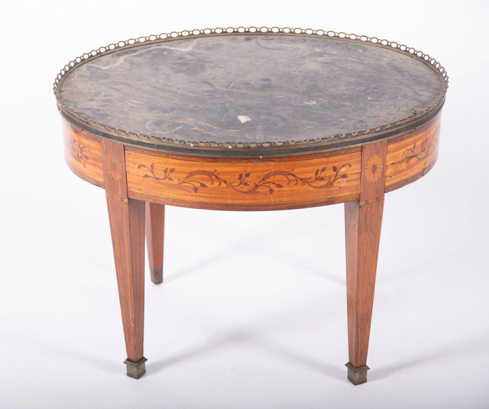 Antique French Marble Top Tea Table: Antique French Marble Top Tea Table oval tea table with black marble reticulated gallery top and inlaid floral designs on tapered legs. 19 1/2 x 26 x 20 1/4 inches