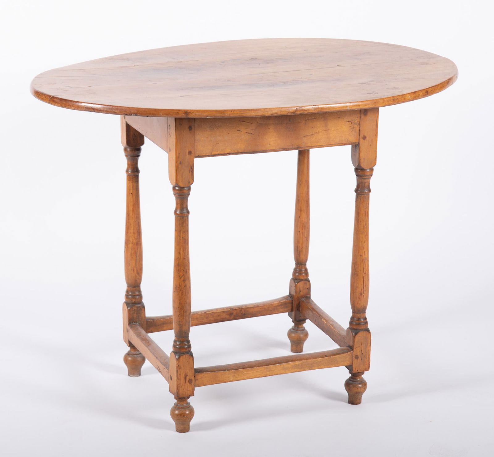 Antique American William and Mary Design Tea Table: Antique American William and Mary Design Tea TableOval top above four block, ringed and vasiform legs with stretchers.27 x 35 x 24 inches