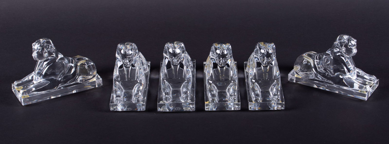 Six Baccarat Crystal Sphinx Paperweights: Six Baccarat Crystal Sphinx Paperweights France, late 20th century, 6 signed clear crystal Sphinx paperweights. 3 1/4 x 4 3/4 x 1 7/8 inches