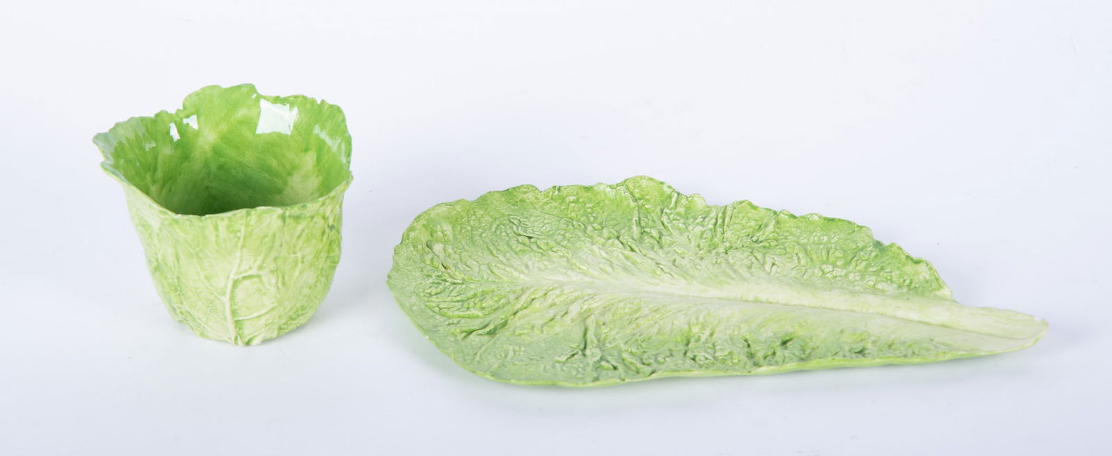 Two Vintage Ceramic Lettuce Serving Pieces, Mary Kirk Kelly: Two Vintage Ceramic Lettuce Serving Pieces, Mary Kirk Kelly American, Mary Kirk Kelly (1918-2013), two lettuce serving pieces, both artist signed, to include a 5 1/2 x 9 1/2 inch serving tray, and a
