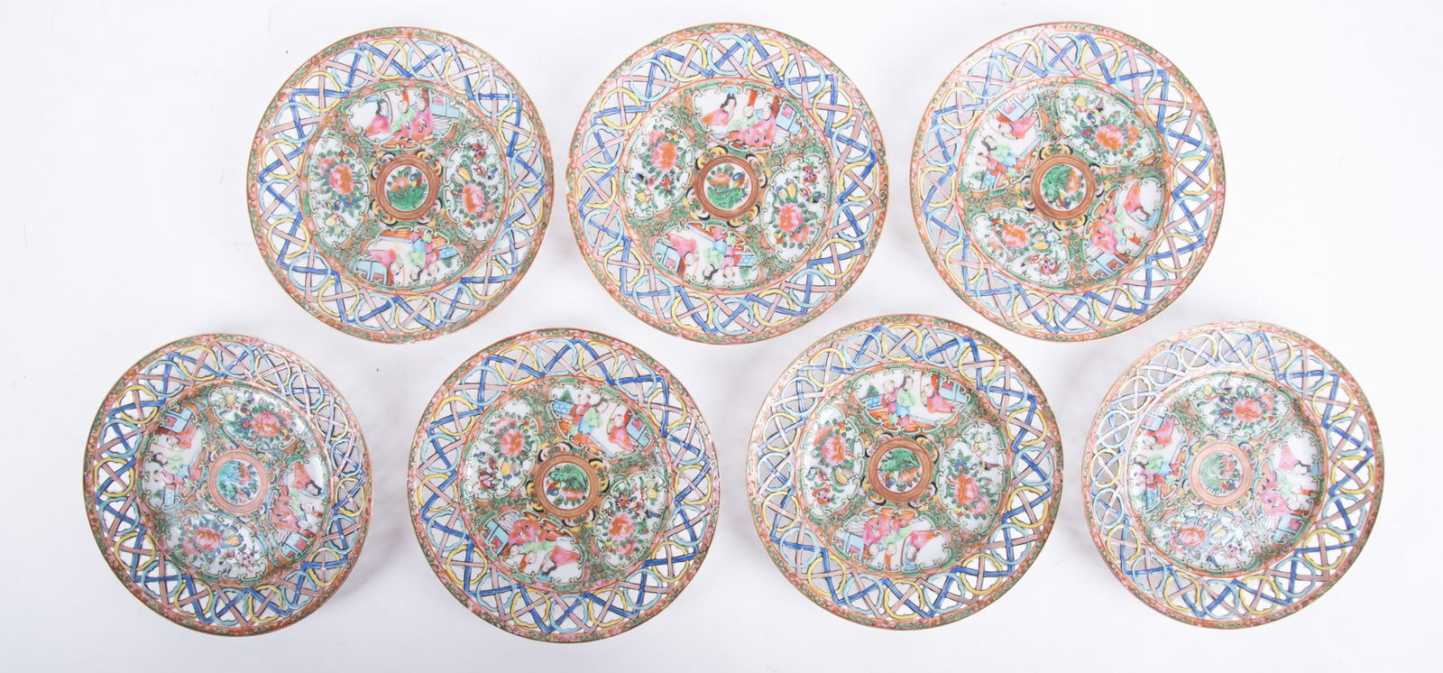 A Rare Set of Chinese Export Rose Medallion Reticulated Plates: A Rare Set of Chinese Export Rose Medallion Reticulated PlatesChina, late 19th century, 7 plates having an unusual OX reticulated pattern to the border, the central well of the plate finely enameled w