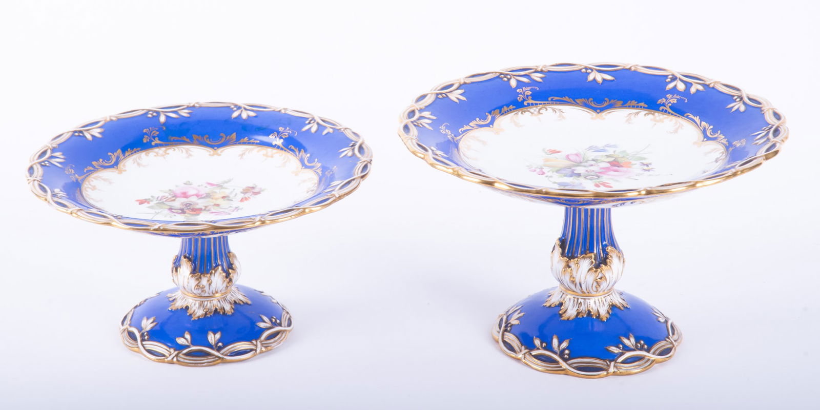 Two Fine Antique Staffordshire Porcelain Desert Compotes, likely Coalport: Two Fine Antique Staffordshire Porcelain Desert Compotes, likely Coalport England, mid-19th century, two beautiful porcelain tazza, each decorated in trims of cobalt blue with gold gilt highlights