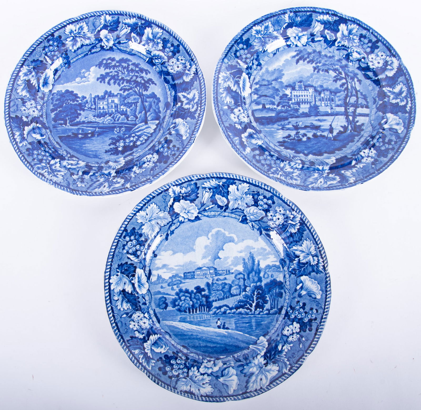 Three Staffordshire Historic Blue Stately Home Series Plates by Enoch Wood: Three Staffordshire Historic Blue Stately Home Series Plates by Enoch WoodEngland, early 19th century, the three different blue transferware plates depicting historic English homes and countryside, ea