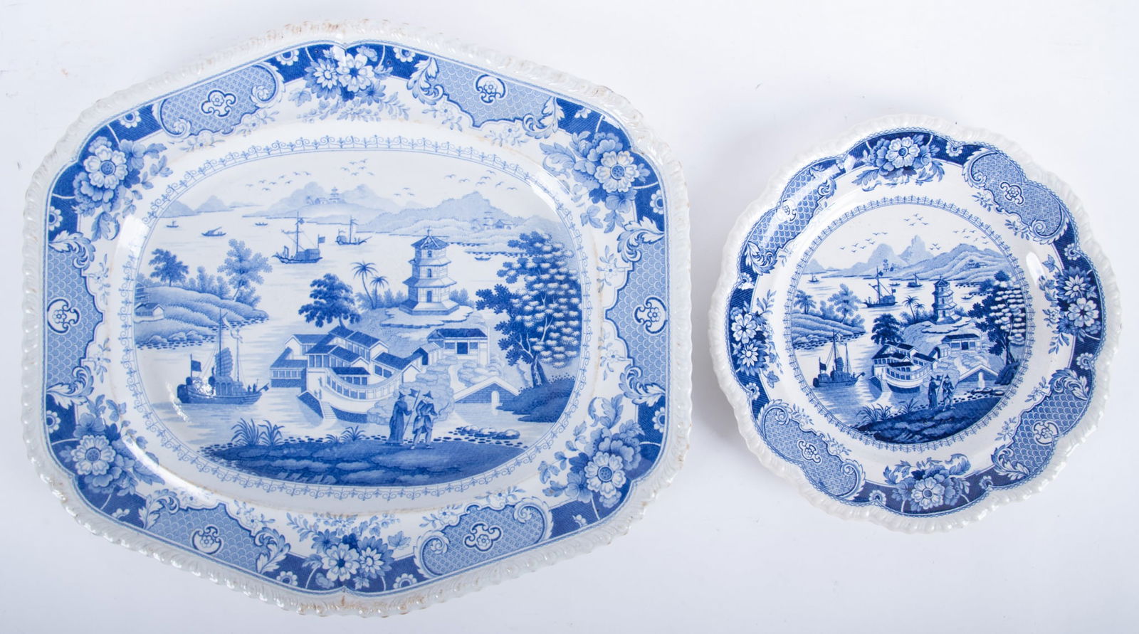 An Early 19th Century Blue Transferware Platter and Plate, India Temple by Ridgway: An Early 19th Century Blue Transferware Platter and Plate, India Temple by RidgwayEngland, circa 1820, a serving platter, paired with a dinner plate, produced by John & William Ridgway at Stoke-on-Tre
