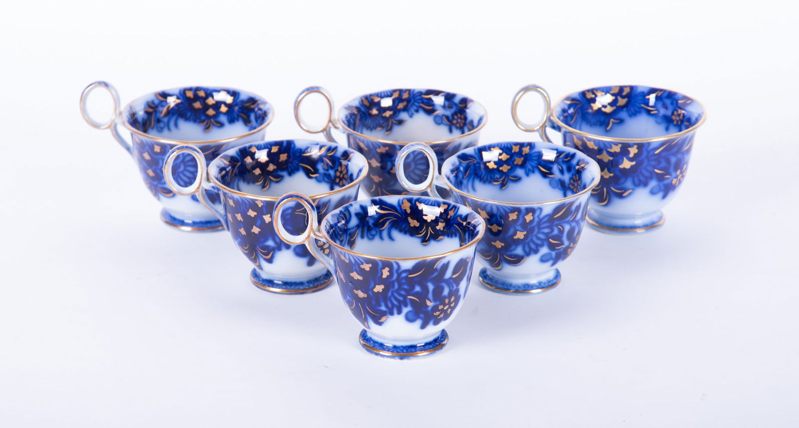 A Rare Set of Six Antique Staffordshire Flow Blue Coffee Cups, Oriental by Samuel Alcock: A Rare Set of Six Antique Staffordshire Flow Blue Coffee Cups, Oriental by Samuel AlcockEngland, circa 1840, a difficult to find set of 6 deep blue and white flow blue coffee cups in the popular Orien