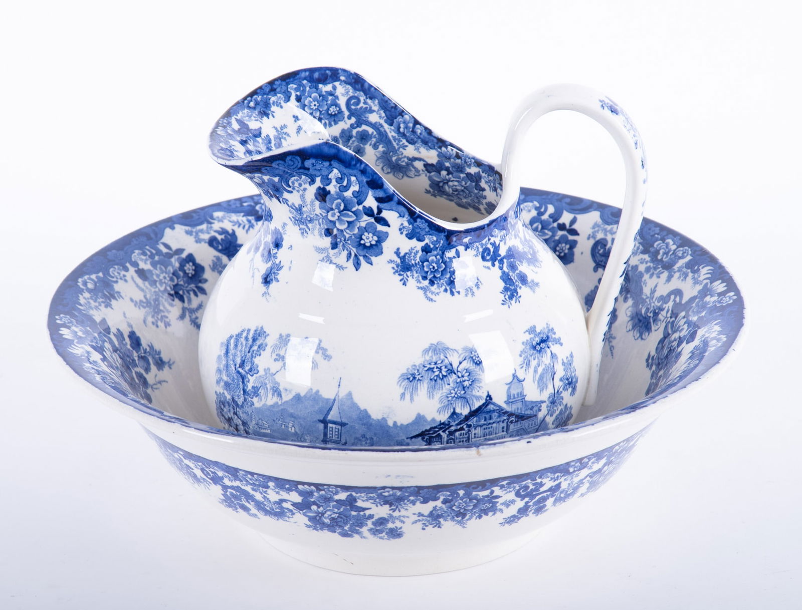 A Large 19th Century Minton Genevese Pitcher and Bowl Set: A Large 19th Century Minton Genevese Pitcher and Bowl Set England, late 19th century, a matched pitcher and bowl set, both decorated with images of a Swiss mountain village with scrolling floral