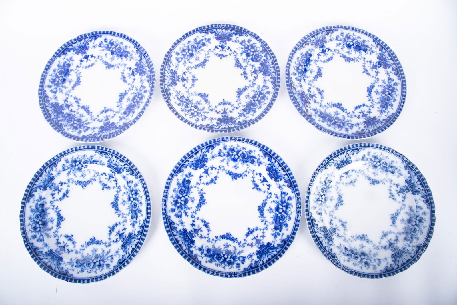 A Grouping of Six Flow Blue Dinner Plates, Coronet by Sampson Hancock and Sons: A Grouping of Six Flow Blue Dinner Plates, Coronet by Sampson Hancock and SonsStaffordshire, early 20th century, an assembled collection of dinner plates to include: Two 10 inch dinner plates (one wit