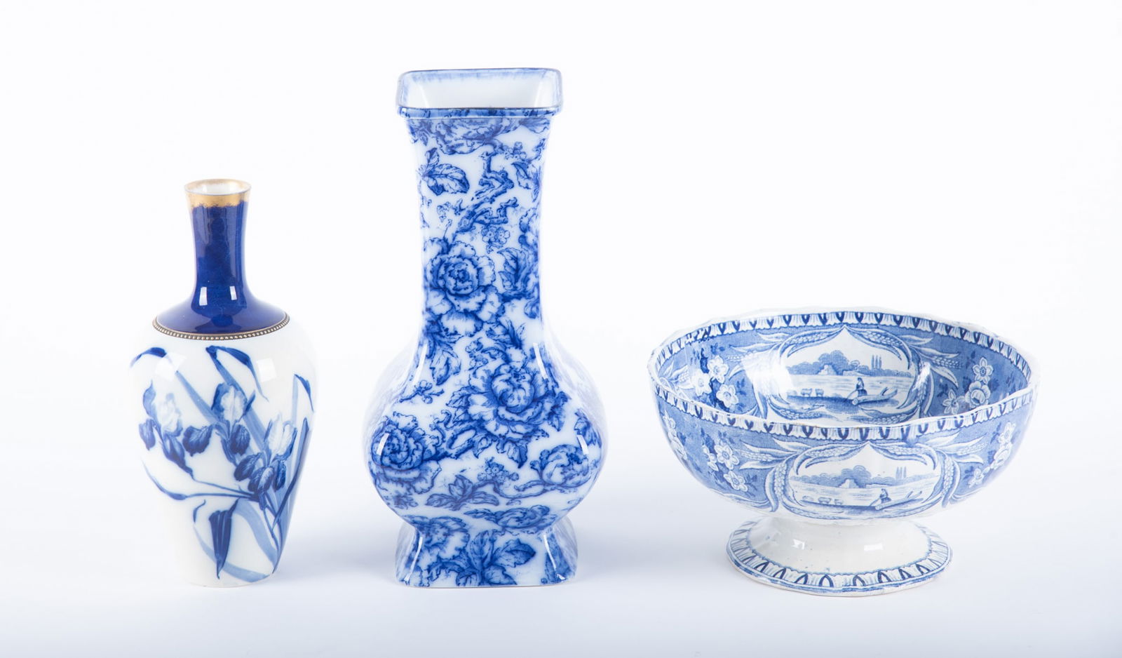 Three Pieces of Antique English Flow Blue: Three Pieces of Antique English Flow BlueStaffordshire, mid 19th century, a large footed fruit bowl in the "Pastoral" pattern by B.H. & S, having bucolic scenes of farm work and villages (5 1/2 x 10 i