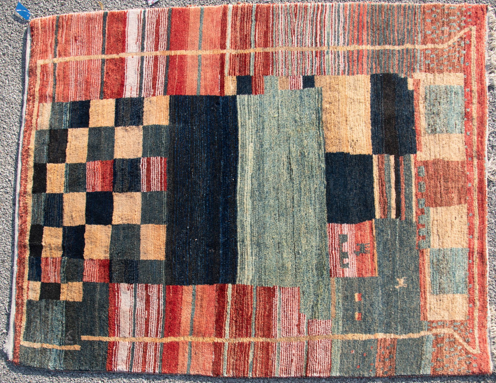 Hand knotted Persian Gabbeh Area Rug: Hand knotted Persian Gabbeh Area Rug Having a geometric pattern of various boxes, bands and panels in colors of gold, blue, black and red. 5' 2" x 6' 4"