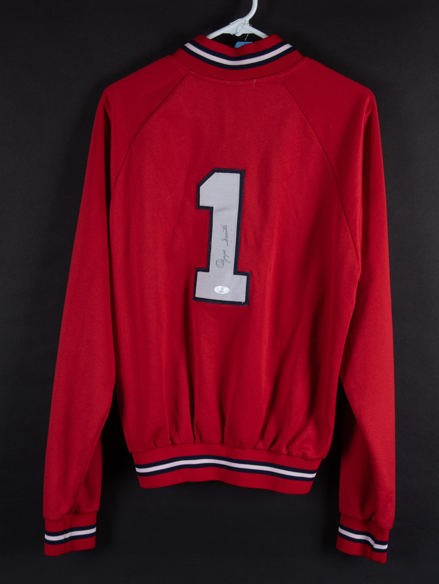 Ozzie Smith Signed Red Pull Over Zip Top Fleece: Ozzie Smith Signed Red Pull Over Zip Top FleeceAuthentic Majestic Collection signed on the number one on the back. JSA AC 10083.