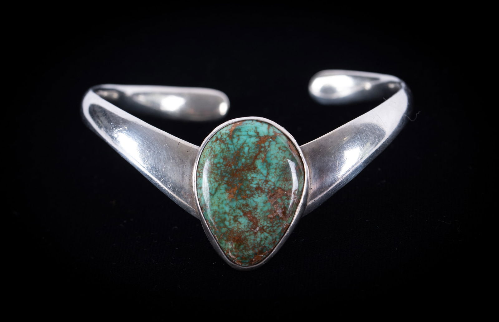 Taxco Sterling Bracelet with Green Turquoise: Taxco Sterling Bracelet with Green TurquoiseThis Chevron Style bracelet has an excellent pear shaped green turquoise stone. It measures 6 1/2 inches around including a 3/4 inch break. Weight including