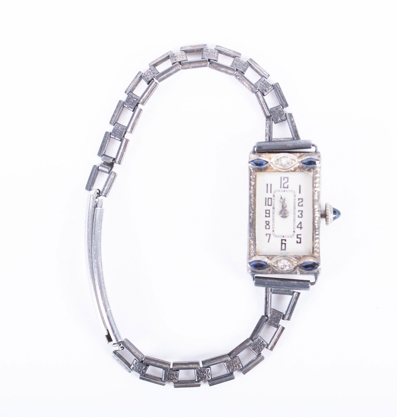 Hadley Oxidized Platinum Watch with Diamonds & Sapphires: Hadley Oxidized Platinum Watch with Diamonds & Sapphires This watch tests platinum and is marked Hadleyite with the numbers 1.966.063. The circumference is 6 1/2 inches and the gross weight is 13.5g.