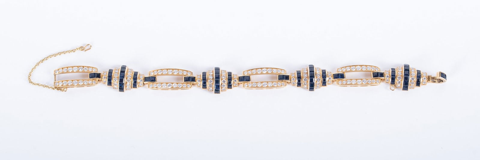 Dazzling 18K Yellow Gold Diamond & Sapphire Bracelet: Dazzling 18K Yellow Gold Diamond & Sapphire BraceletThis bracelet has approximately 1.52 CTW in diamonds and 84 princess cut sapphires. It is 7 inches long and weighs 23.2g including stones.