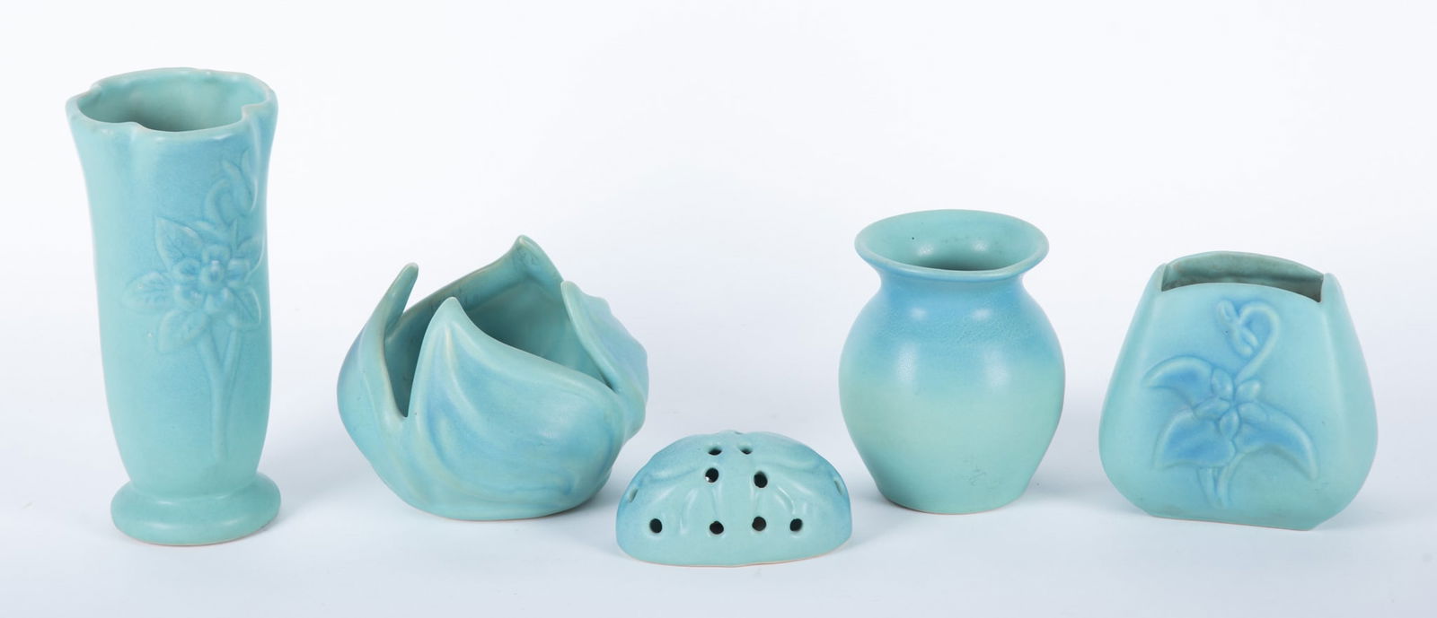 Ming Blue Van Briggle Pieces: Ming Blue Van Briggle Pieces five pieces of Van Briggle pottery with Mind blue glaze. One flower frog, three vases, and a lotus leaf bowl. All signed on base, some by artists, dating between