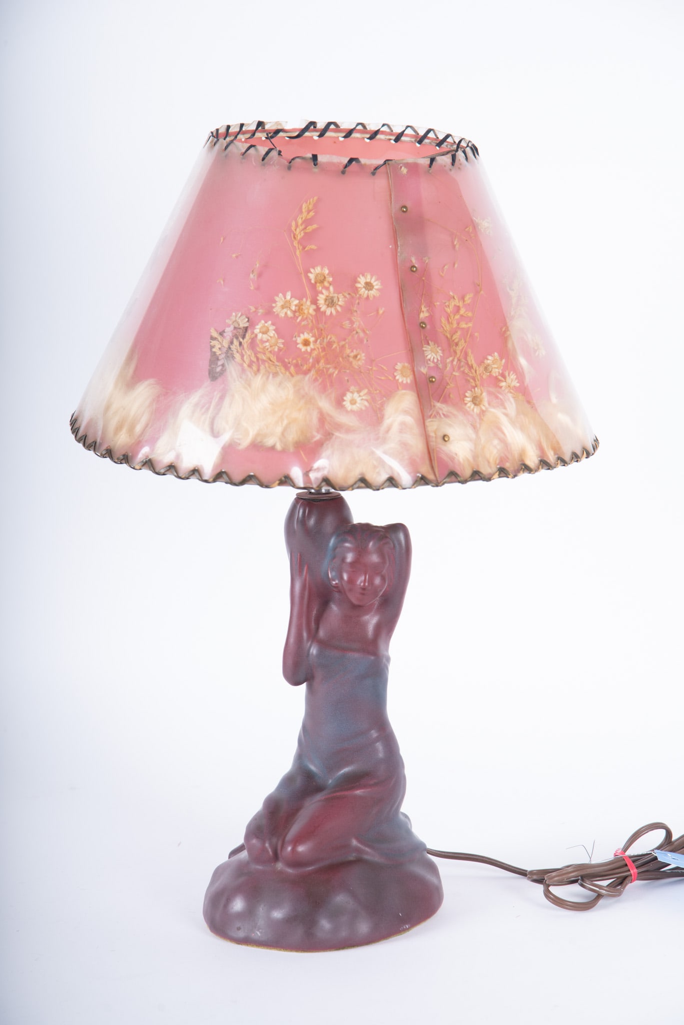 Van Briggle Pottery Lamp Damsel of Damascus: Van Briggle Pottery Lamp Damsel of Damascus Circa 1940s. Felt covering the underside. Mulberry matte glaze. With original butterfly shade. Lamp base measures 12 1/4 x 5 x 6 inches. Shade measures 7