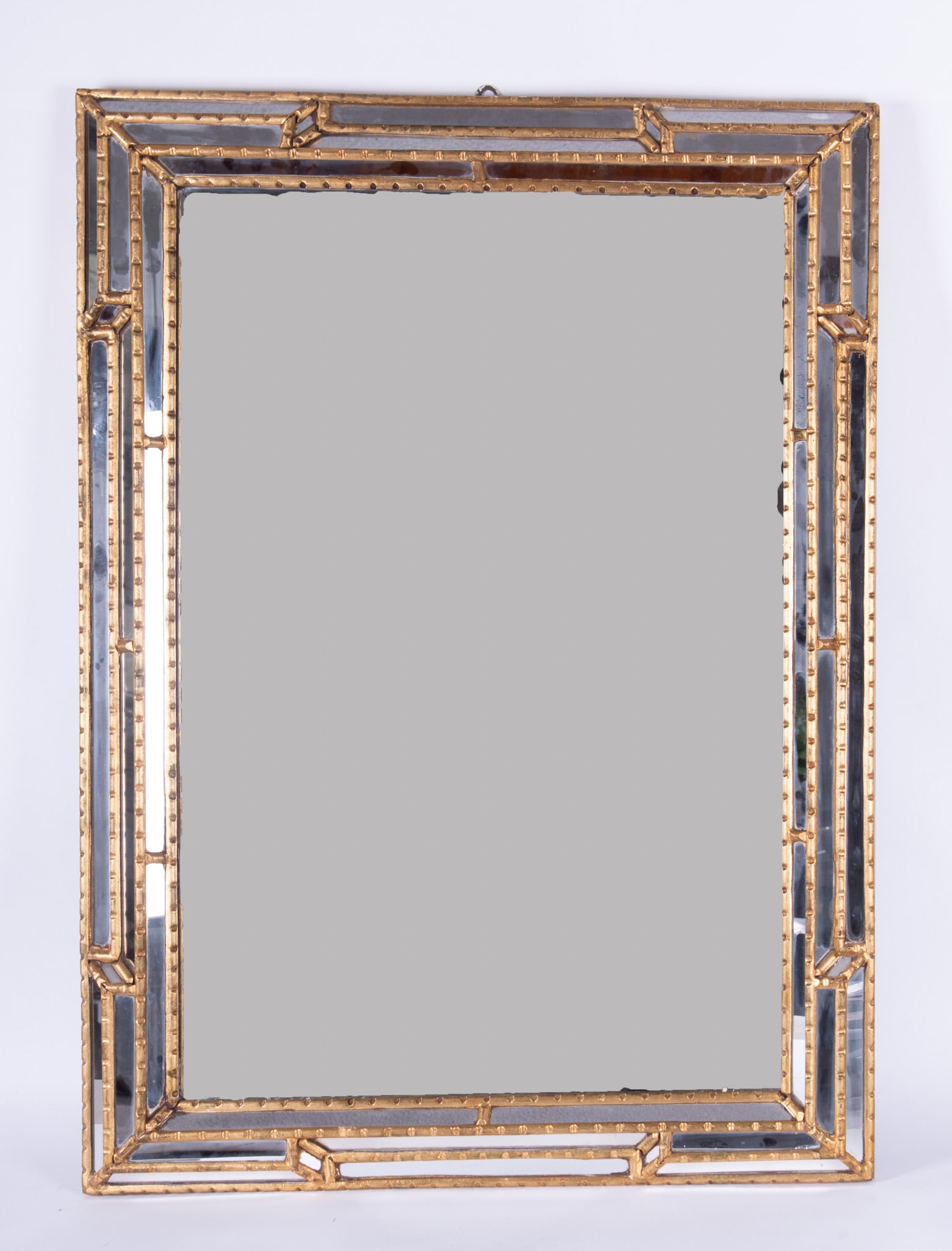 Italian Hollywood Regency Wall Mirror: Italian Hollywood Regency Wall MirrorRectangular form with the frame having all over gilt and mirrored highlights30 x 42 1/2 inches