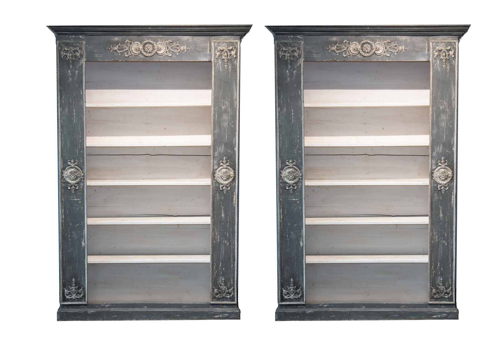 A Monumental Pair of French Provincial Bookshelves: A Monumental Pair of French Provincial Bookshelves Embellished with Neoclassical design accents consisting of five removable wooden shelves with stressed grey painted finish. Each unit is adorned