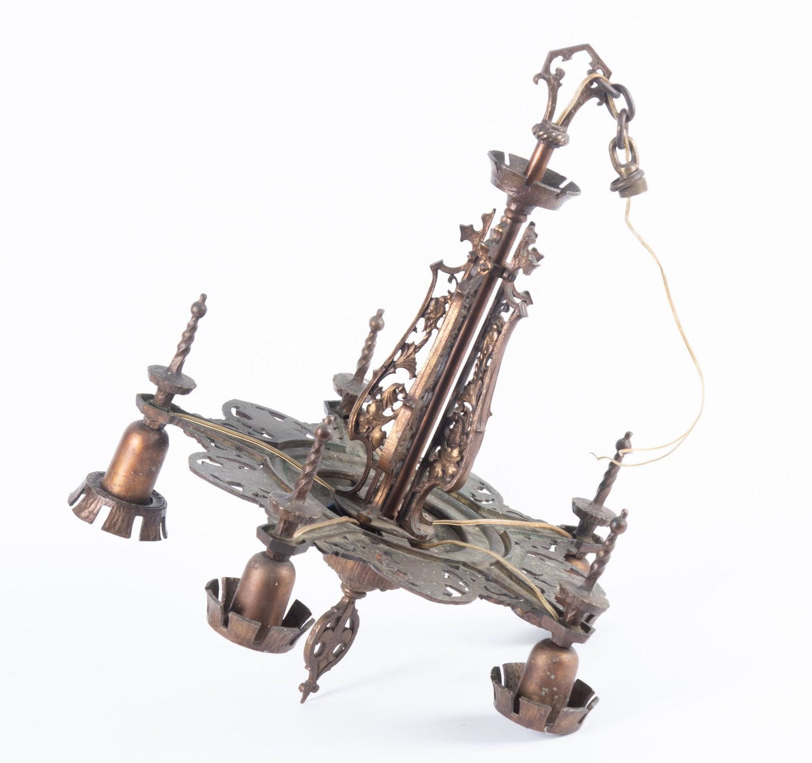 1920's Ornate Cast Iron Chandelier: 1920's Ornate Cast Iron Chandelier The five light chandelier features a fusion of Art Deco geometric elements and dramatic Gothic Revival aesthetics. It includes intricate open work metalwork. 28 x