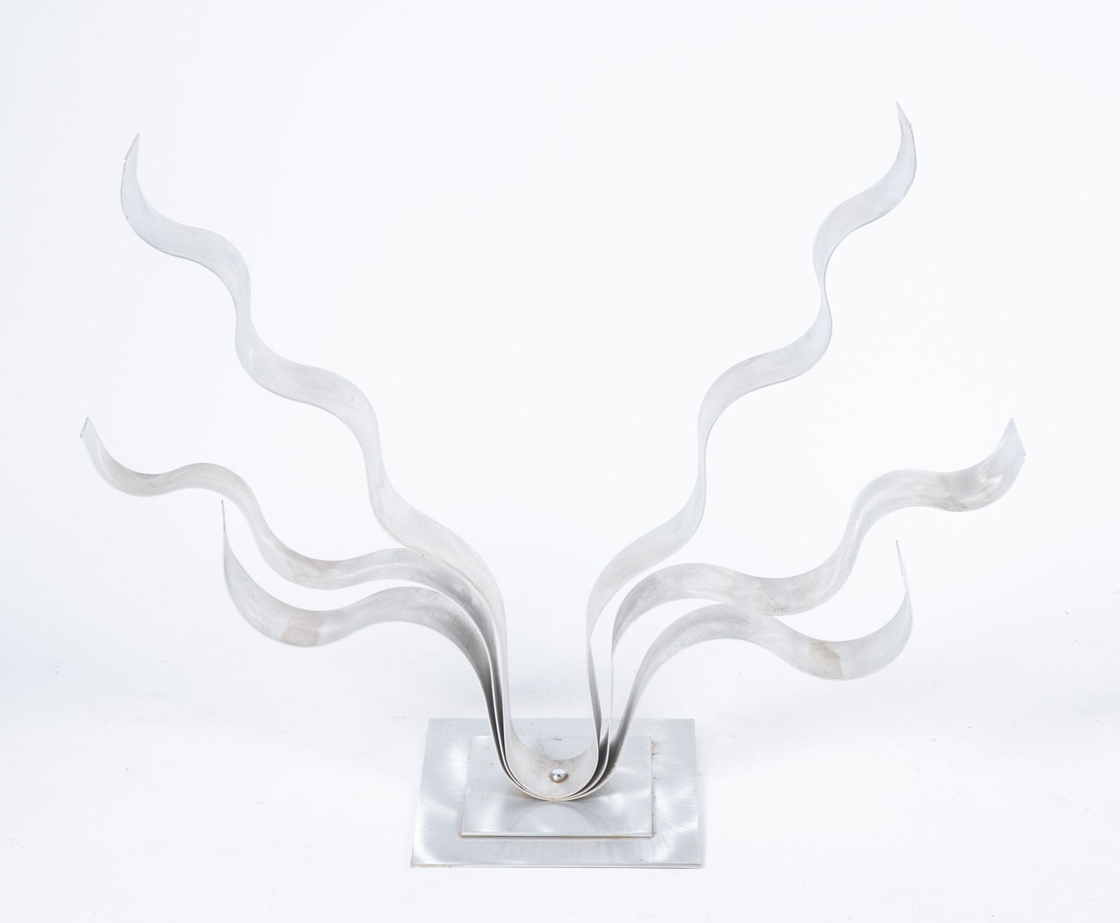 Abstract Sculpture By Jon Allen: Abstract Sculpture By Jon AllenFree standing art sculpture with fluid ribbon like form crafted from textured aluminum. Signed underneath.30 1/4 x 38 1/2 x 12 inches