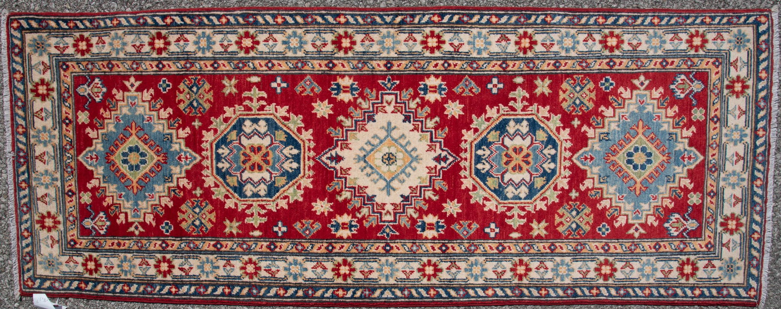 Handwoven Kazak Runner: Handwoven Kazak Runner Five alternating medallions from octagonal to stepped all on a red field. 2' 7" x 6' 5"'