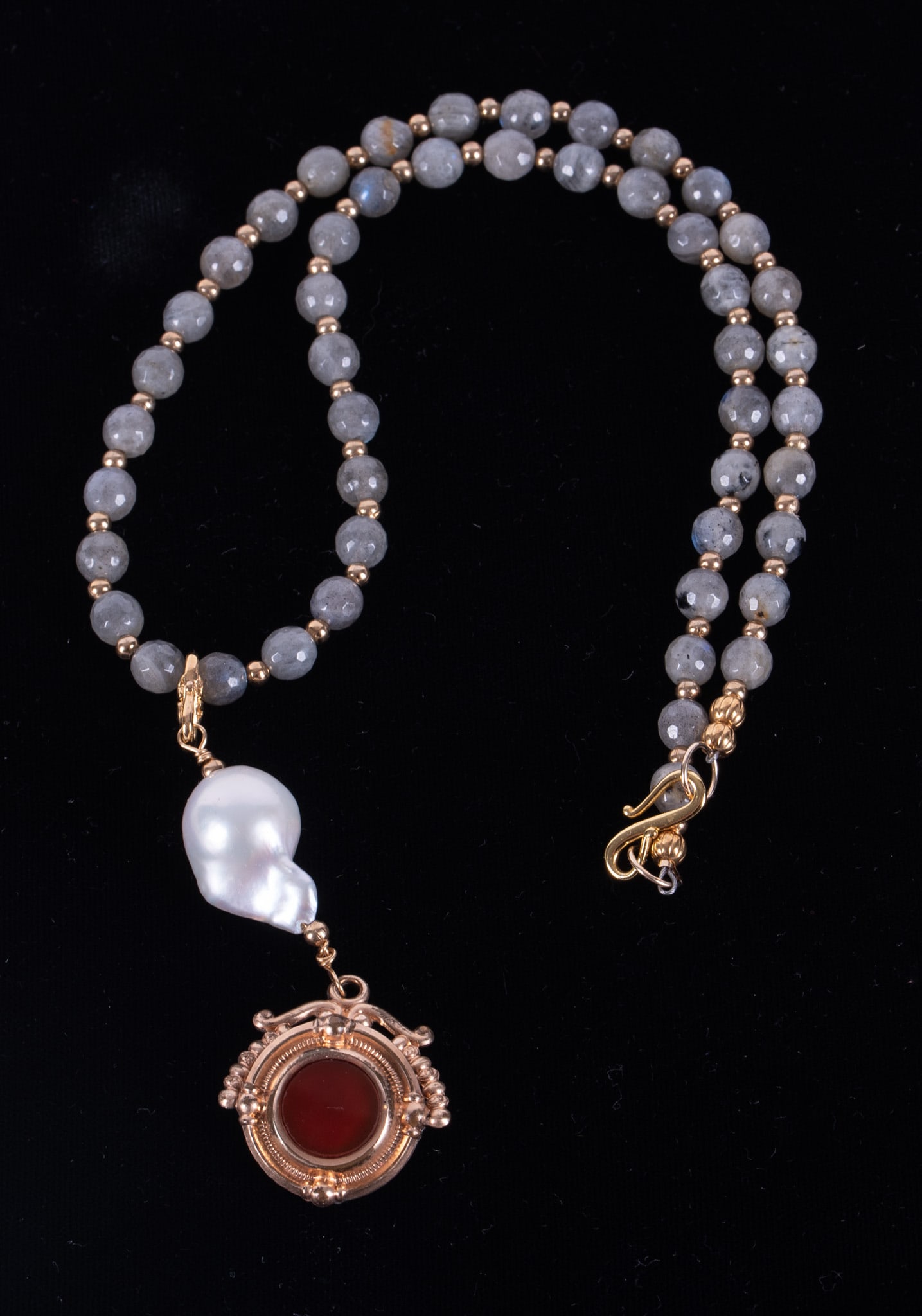 Swivel Watch Fob Necklace with Labradorite & a Baroque Pearl: Swivel Watch Fob Necklace with Labradorite & a Baroque Pearl The antique fob on this necklace is gold filled set with a carnelian on one side and a carved mother of pearl on the other. The baroque
