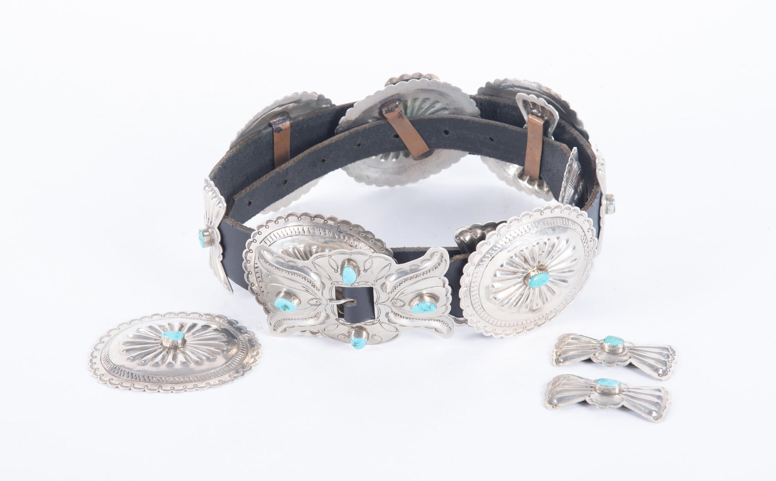 Vintage Native American Concho Belt: Vintage Native American Concho BeltThe conchos on this classic belt are made from nickel silver and set with turquoise. It is 42 inches long and has 6 oval conchos with one additional included and two