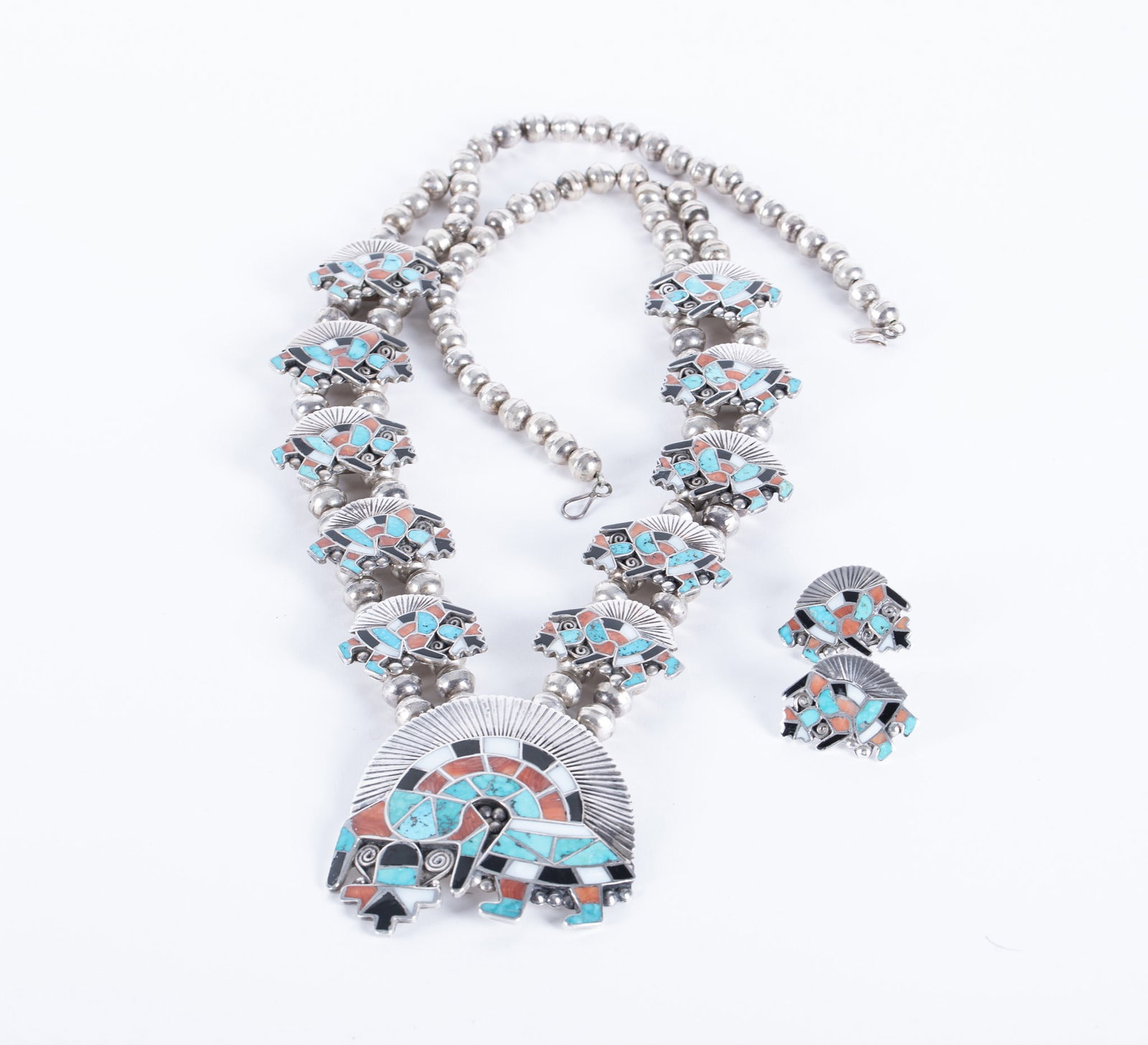 Zuni Rainbow Man Squash Blossom Necklace with Earrings: Zuni Rainbow Man Squash Blossom Necklace with EarringsWant to make a statement!!! This is a truly amazing example of early Zuni Pueblo inlay work. The stones are jet, turquoise, coral and mother of pe