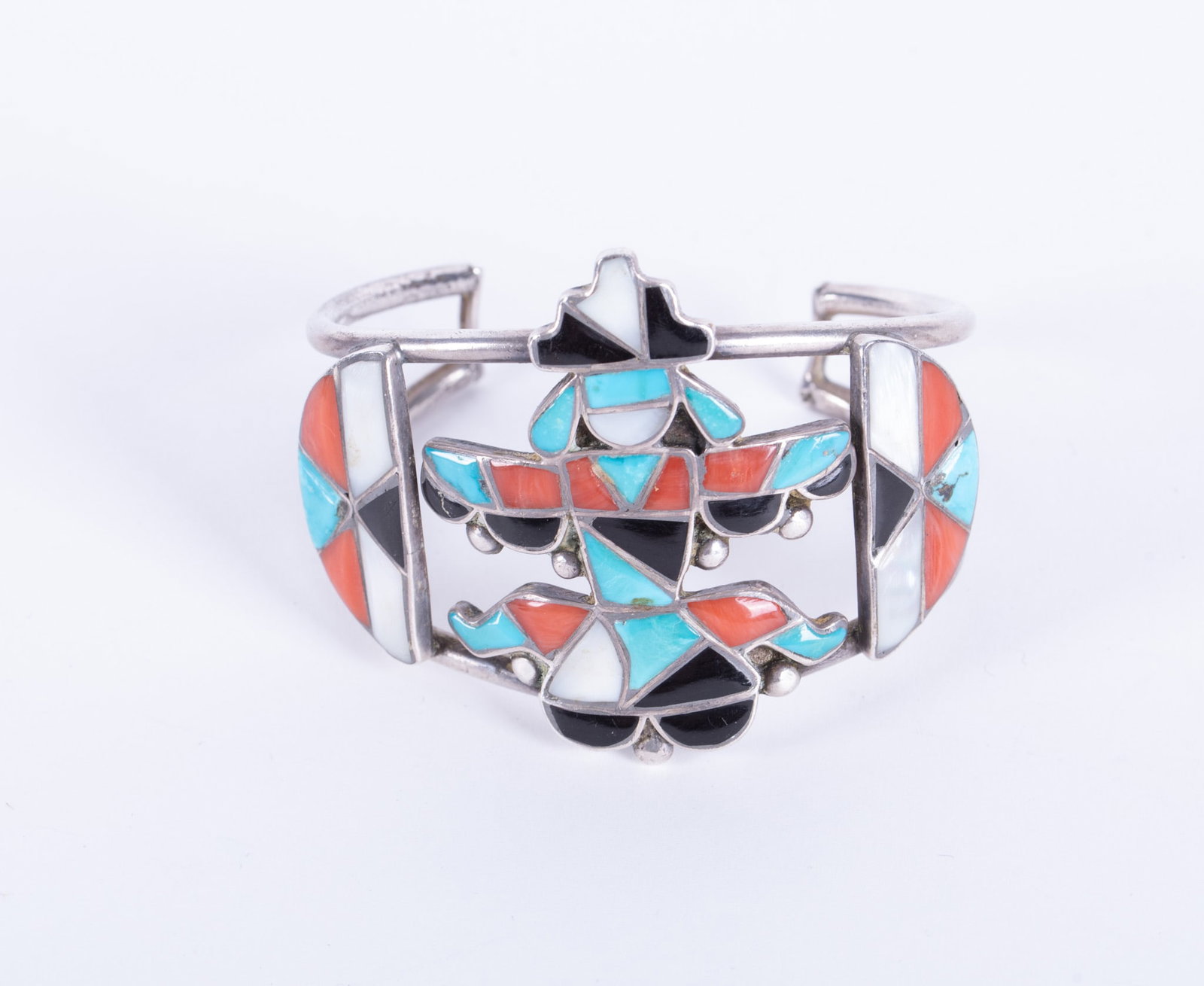 Zuni Multi-Stone Inlay Knifewing Sterling Cuff Bracelet: Zuni Multi-Stone Inlay Knifewing Sterling Cuff BraceletThis vintage cuff in inlaid with turquoise, coral, jet and mother of pearl. The inner circumference is 5 1/2 inches with a 1 3/8 inch break. One