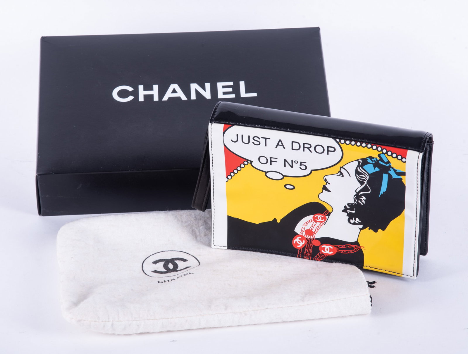 Chanel Patent Leather "Just A Drop of No 5" Clutch Bag, Ltd. Ed.: Chanel Patent Leather "Just A Drop of No 5" Clutch Bag, Ltd. Ed.Black patent leather, design with black/white/yellow/red/blue patent leather, 8 7/8 x 6 x 2 inches; with original dust bag, Chanel authe