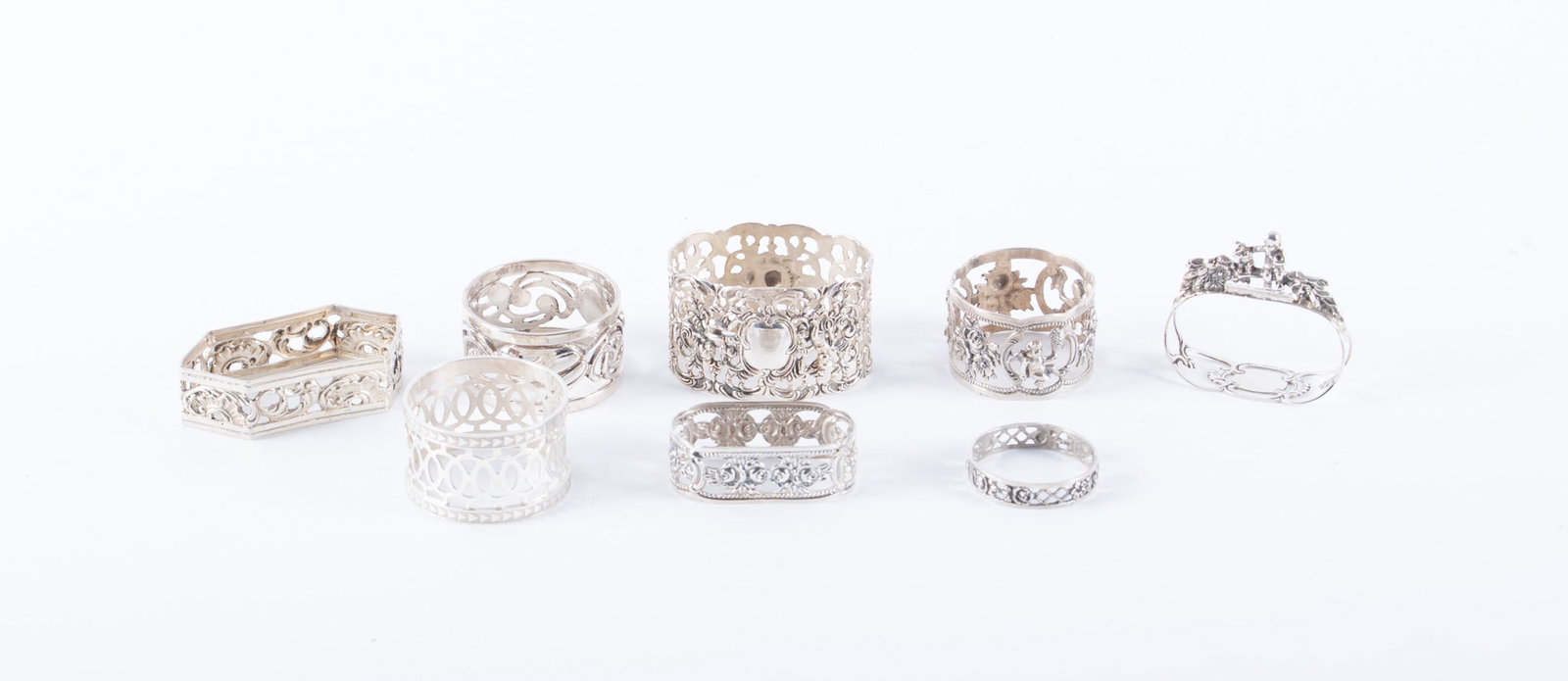 A Charming Collection of Eight Different Silver Reticulated Napkin Rings (1 of 4)