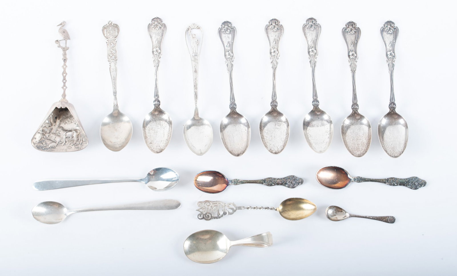 Collection of Sterling Spoons and Souvenir Spoons: Collection of Sterling Spoons and Souvenir Spoons(13) Thirteen sterling spoons along with two plated spoons and an unidentified salt/sugar shovel.Various sizes and makers. Total weight of sterling spo