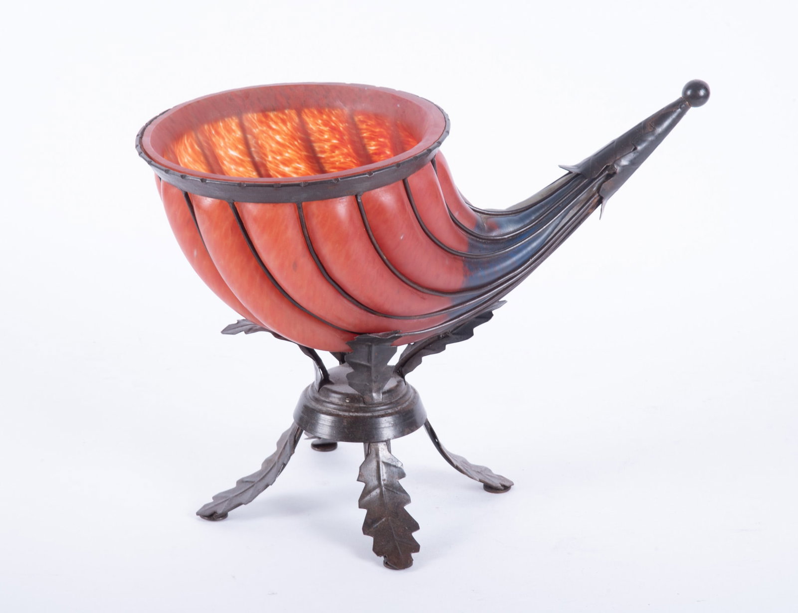 Vintage Art Glass Cornucopia Vase Housed in a Wrought Iron Base: Vintage Art Glass Cornucopia Vase Housed in a Wrought Iron BaseThis decorative piece has a mottled carnelian colored glass body transitioning into a cobalt blue color. It measures 16 inches long & 11