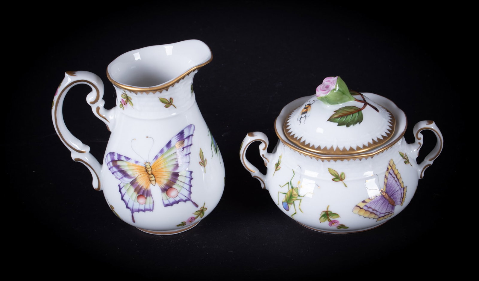An Anna Weatherley Porcelain Creamer and Sugar Set, Spring in Budapest: An Anna Weatherley Porcelain Creamer and Sugar Set, Spring in BudapestHungary, a covered sugar bowl with creamer in the Spring in Budapest pattern by Anna Weatherly designs. Each piece hand painted wi