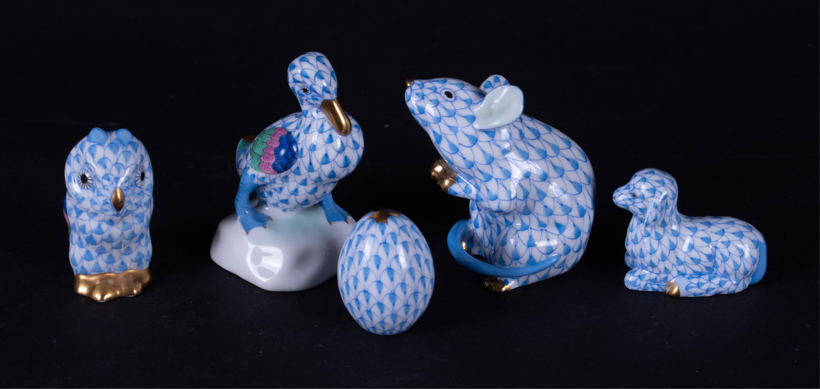 Four Herend Miniature Animals and an Egg: Four Herend Miniature Animals and an Egg Hungary, all in blue fishnet, the lot consists of a 2 1/4 inch seated Mouse, a 2 5/8 inch strutting Duck, a 1 7/8 inch Owl, a 1 3/8 inch recumbent Sheep, and