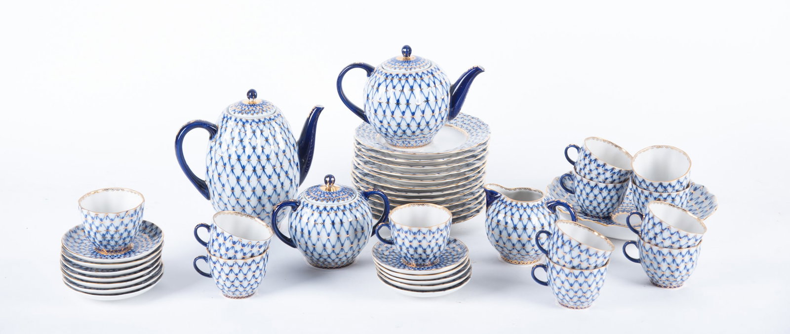 Russian Lomonosov Cobalt Net Tea Service Set: Russian Lomonosov Cobalt Net Tea Service Set (41) Forty One pieces. All marked on the underside. 12 Dessert plates (7 1/8 inches) 12 Saucers (4 9/16 inches) 12 Cups (2 3/8 x 3 1/2 x 3 inches) 1
