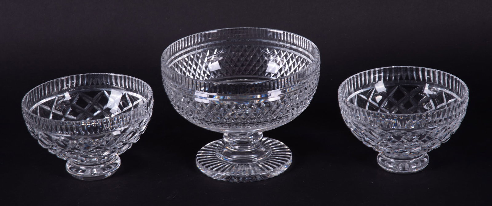 Three Waterford Crystal Footed Bowls: Three Waterford Crystal Footed BowlsA lovely Waterford diamond-cut footed Castletown center bowl (5 1/2 x 7 1/4 inches), and a pair of squat-foot Killeen bowls with cross-hatch cut (3 3/4 x 5 3/4 inch