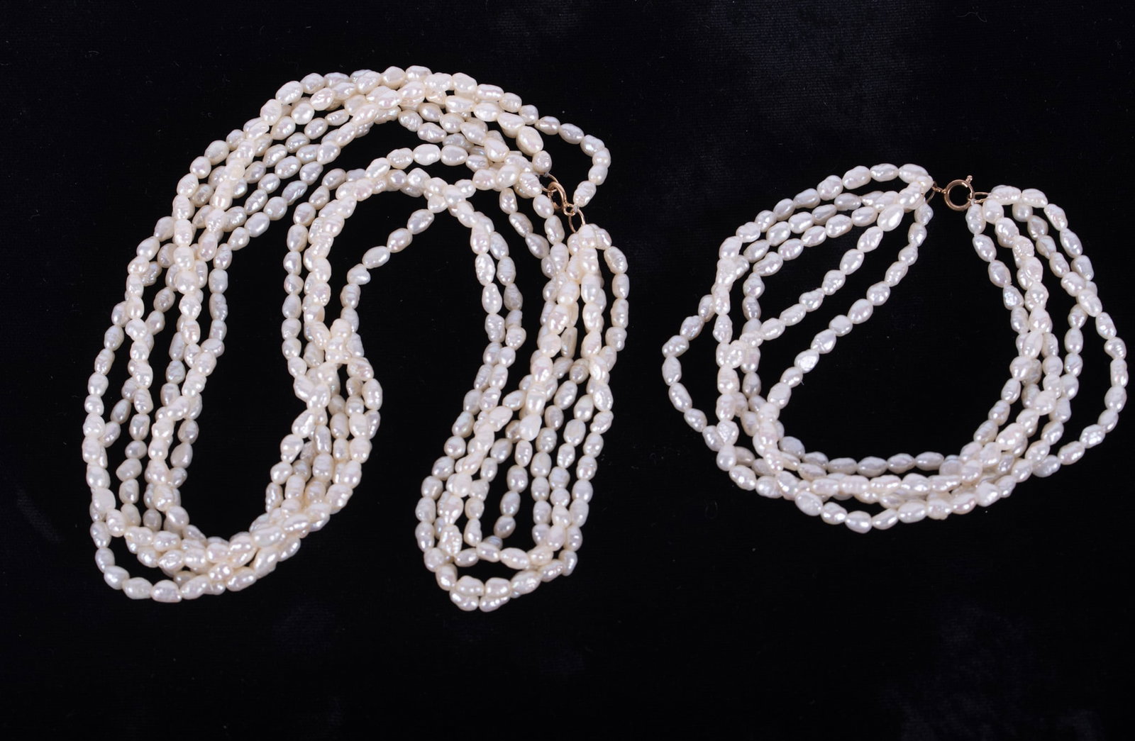 A Nancy McGraw Design Five Strand Freshwater Pearl Necklace/Choker together with Matching Five: Nancy McGraw, Just for Pearls, of Little Rock, Arkansas, noted that her pearls are hand selected worldwide. Length of necklace 18 inches.