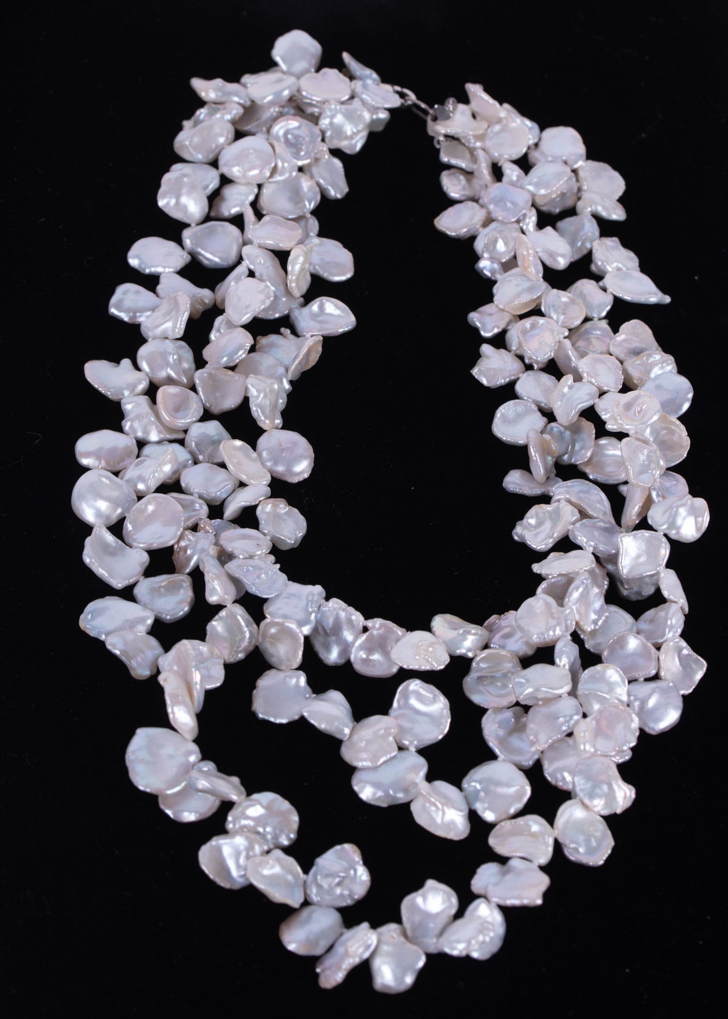 Wonderful Three Strand Keshi Pearl Necklace: The pearls are a lustrous silver/white color. The longest strand is 20 inches, the shortest is 16 inches.