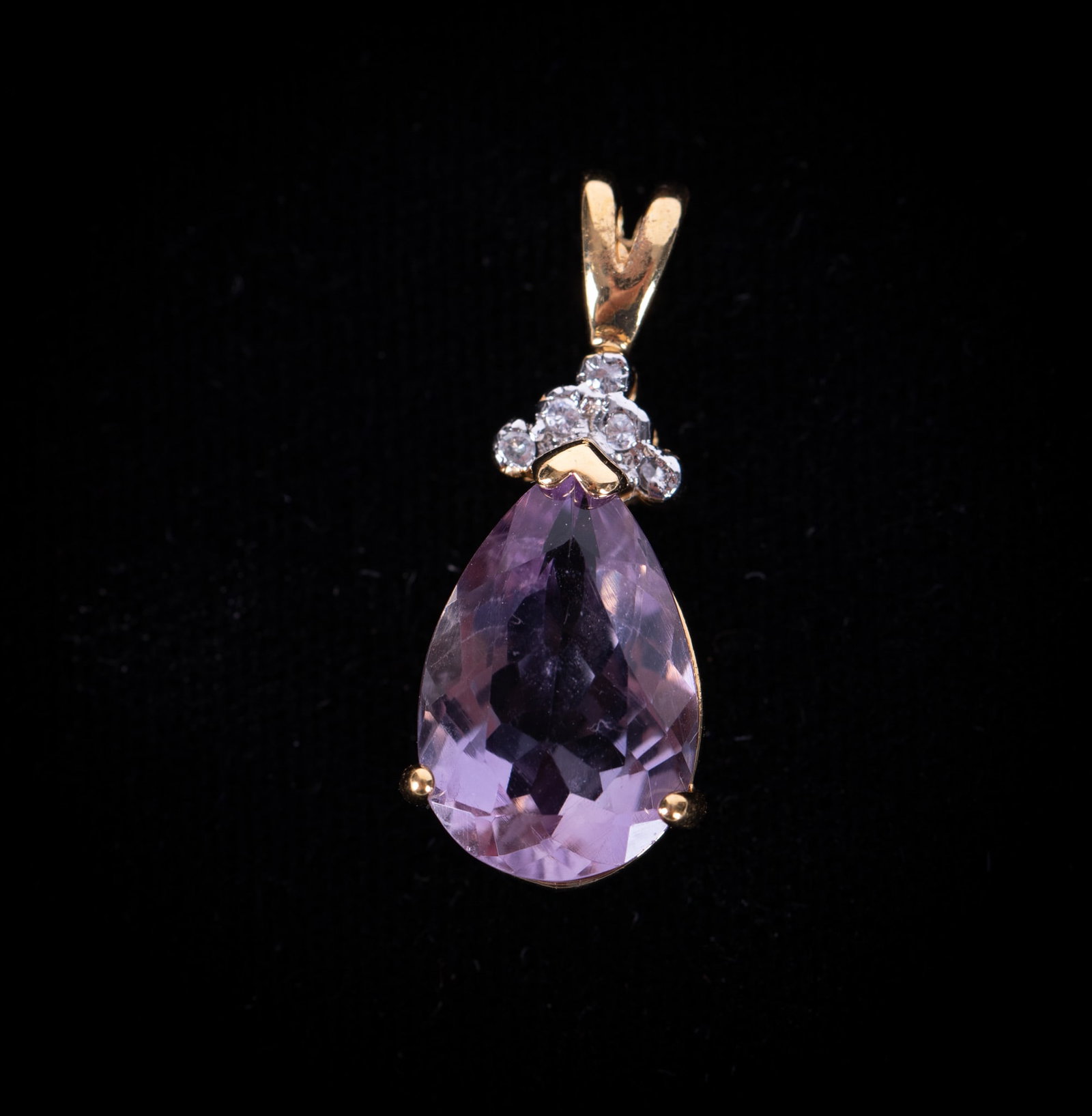 10K Yellow Gold Pendant with Amethyst & Diamonds: The pear shaped pendant measures 13.73mm x 10mm at the widest point. It is crowned with 5 small diamonds and it tests 10k. Weight including stones is 3.1g.